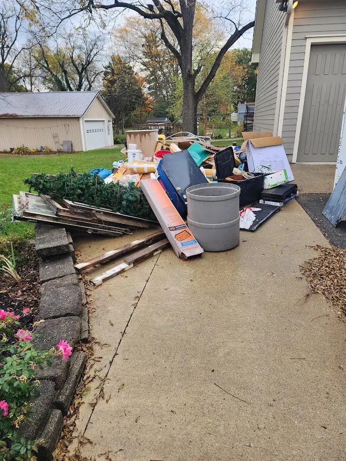 Dumpster being loaded with debris for 30 Yard Dumpster Rental in Wilmington